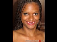 Carol marf is sited on a sofa, legs appart and looking at you