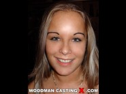 Jessica moore is sited on a sofa, legs appart and looking at you