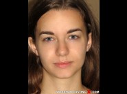 Tali dova is sited on a sofa, legs appart and looking at you