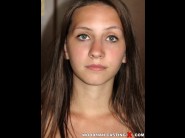 Zelina flash is sited on a sofa, legs appart and looking at you