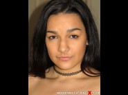 Paisley parker is sited on a sofa, legs appart and looking at you