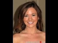 Alice lighthouse is sited on a sofa, legs appart and looking at you