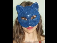 Enolla calabre is sited on a sofa, legs appart and looking at you