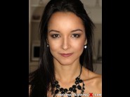 Francys belle is sited on a sofa, legs appart and looking at you