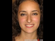 Zoe valami is sited on a sofa, legs appart and looking at you