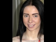 Liz heaven is sited on a sofa, legs appart and looking at you