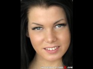 Sofia like is sited on a sofa, legs appart and looking at you