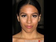 Kiyanna marie is sited on a sofa, legs appart and looking at you