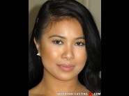 Maya mona is sited on a sofa, legs appart and looking at you