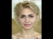 Ollivia jager is sited on a sofa, legs appart and looking at you