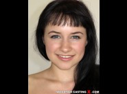 Tanika is sited on a sofa, legs appart and looking at you