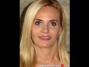 Lili craig is sited on a sofa, legs appart and looking at you