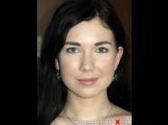 Daphne angel is sited on a sofa, legs appart and looking at you