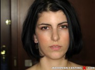 Georgina is sited on a sofa, legs appart and looking at you