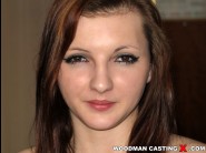 Tyna shy is sited on a sofa, legs appart and looking at you