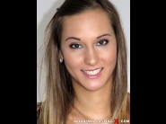 Naomi bennet is sited on a sofa, legs appart and looking at you