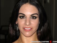 Bella reese is sited on a sofa, legs appart and looking at you