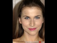 Paola mike is sited on a sofa, legs appart and looking at you