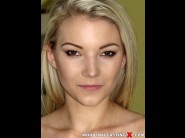 Sweety layne is sited on a sofa, legs appart and looking at you