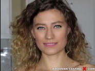 Stasy riviera is sited on a sofa, legs appart and looking at you