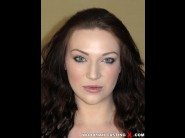 Harmony reigns is sited on a sofa, legs appart and looking at you