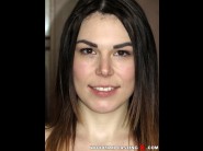 Jessica bell is sited on a sofa, legs appart and looking at you