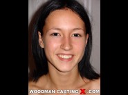 Afrodite night is sited on a sofa, legs appart and looking at you