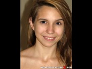 Cece capella is sited on a sofa, legs appart and looking at you