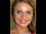 Sofi goldfinger is sited on a sofa, legs appart and looking at you