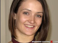 Andi rye is sited on a sofa, legs appart and looking at you