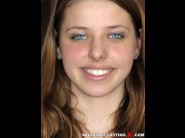 Ornella cyan is sited on a sofa, legs appart and looking at you