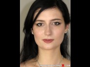 Melody mae is sited on a sofa, legs appart and looking at you