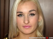 Daisy lee is sited on a sofa, legs appart and looking at you