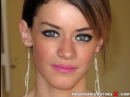 Carla rosa is sited on a sofa, legs appart and looking at you