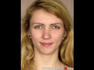 Beatrix glover is sited on a sofa, legs appart and looking at you