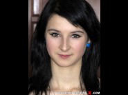 Mary angel is sited on a sofa, legs appart and looking at you