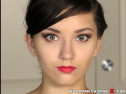 Zara brooks is sited on a sofa, legs appart and looking at you