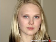 Lily rader is sited on a sofa, legs appart and looking at you