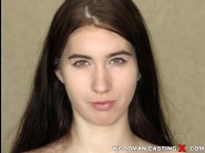 Charlotte shay is sited on a sofa, legs appart and looking at you