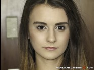 Adelle unicorn is sited on a sofa, legs appart and looking at you