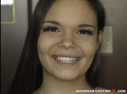 Sofia lee is sited on a sofa, legs appart and looking at you